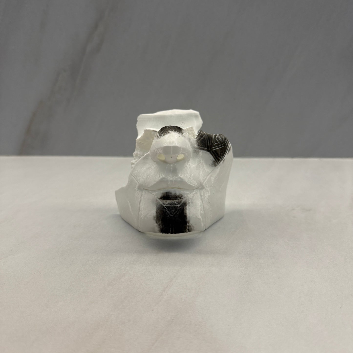 Clear plastic component on a gray background