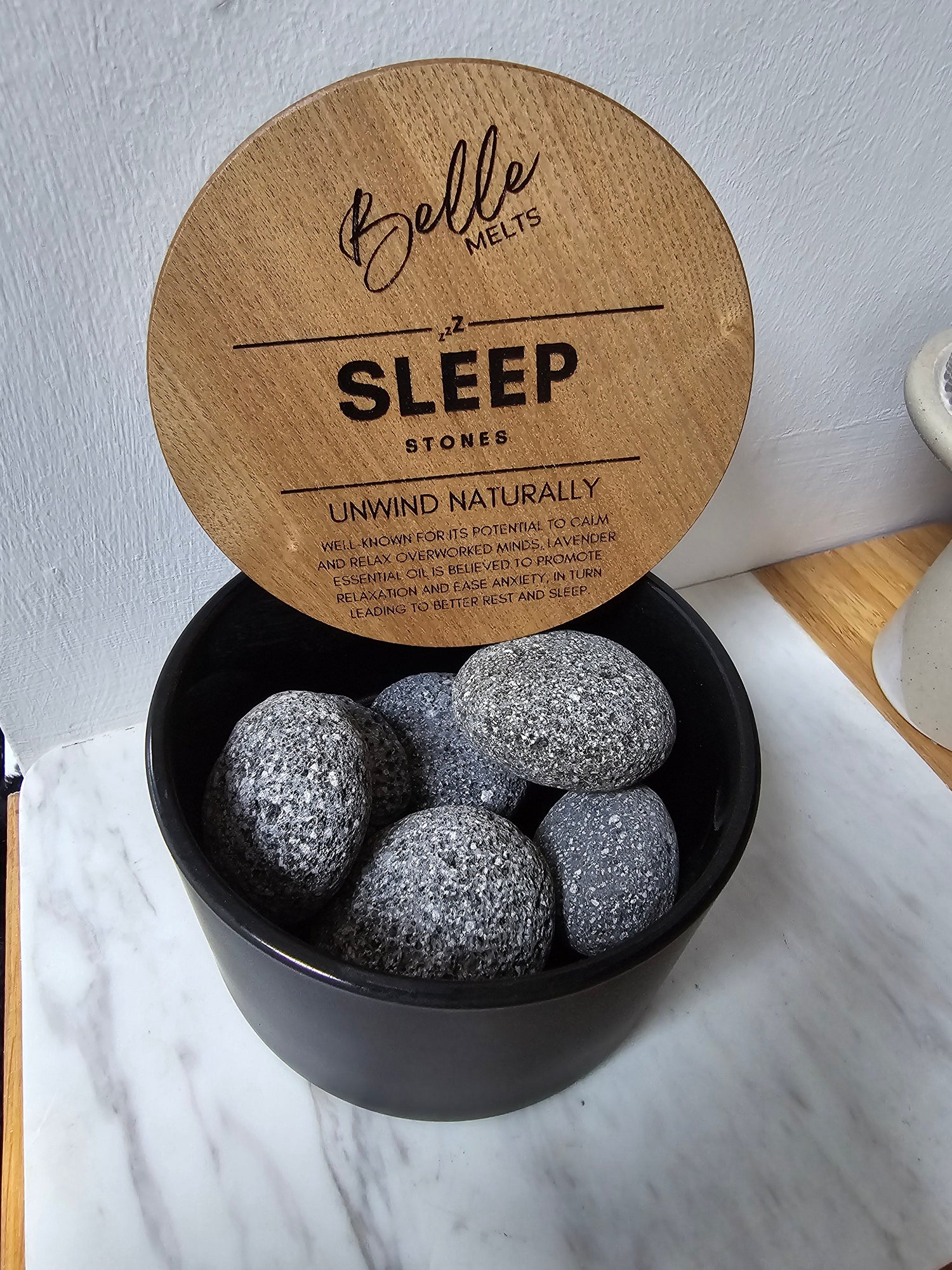 "Belle Melts Serenity Stones arranged decoratively, radiating a calming, long‑lasting scent."