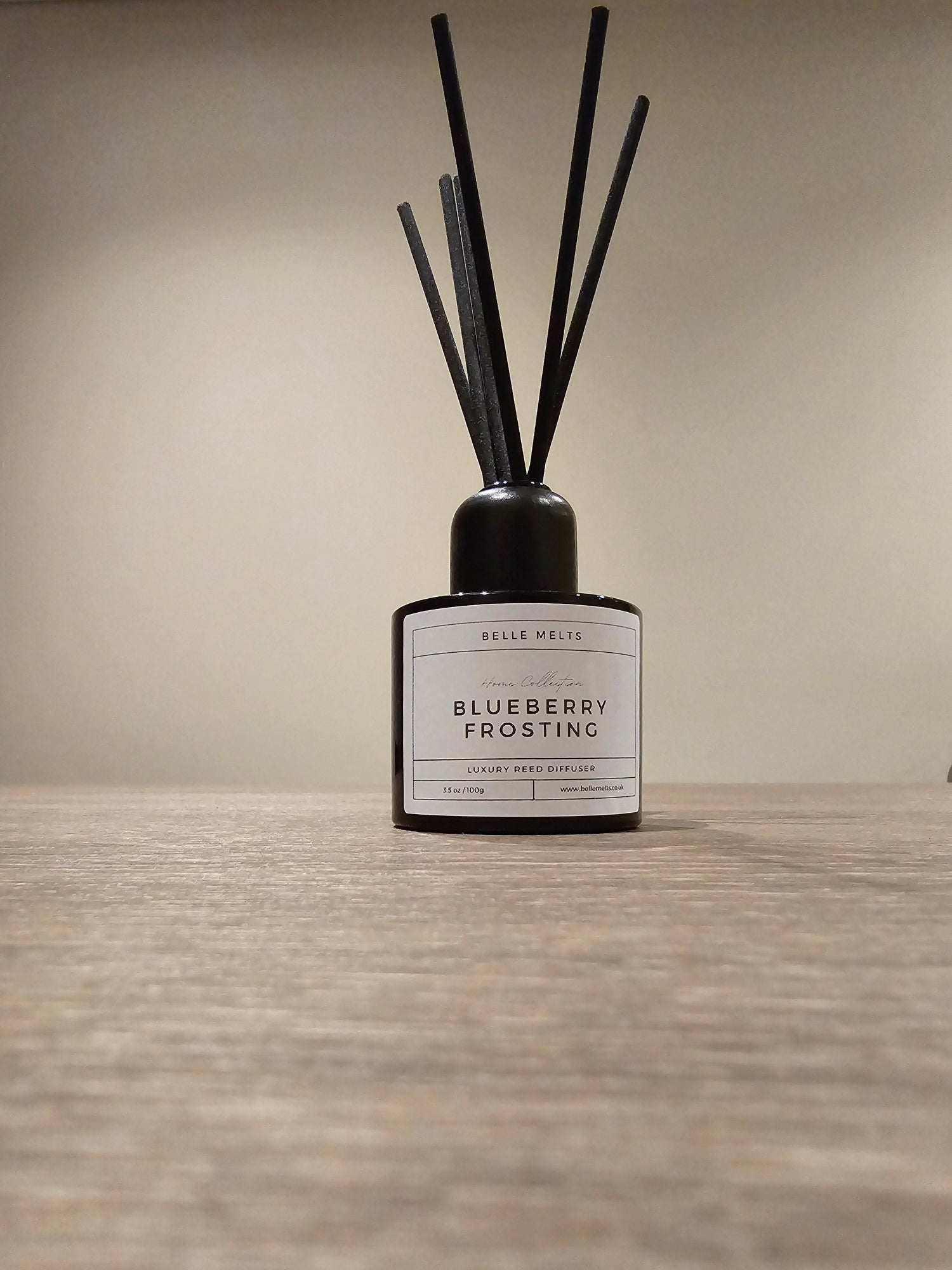 "Belle Melts Reed Diffuser elegantly placed in a room, exuding a subtle, natural fragrance."