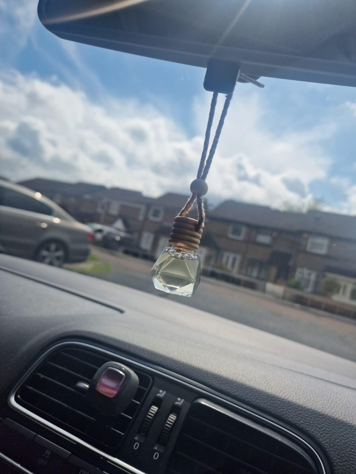 "Belle Melts Car Diffuser installed in a car interior, showcasing sleek design and lasting aroma."