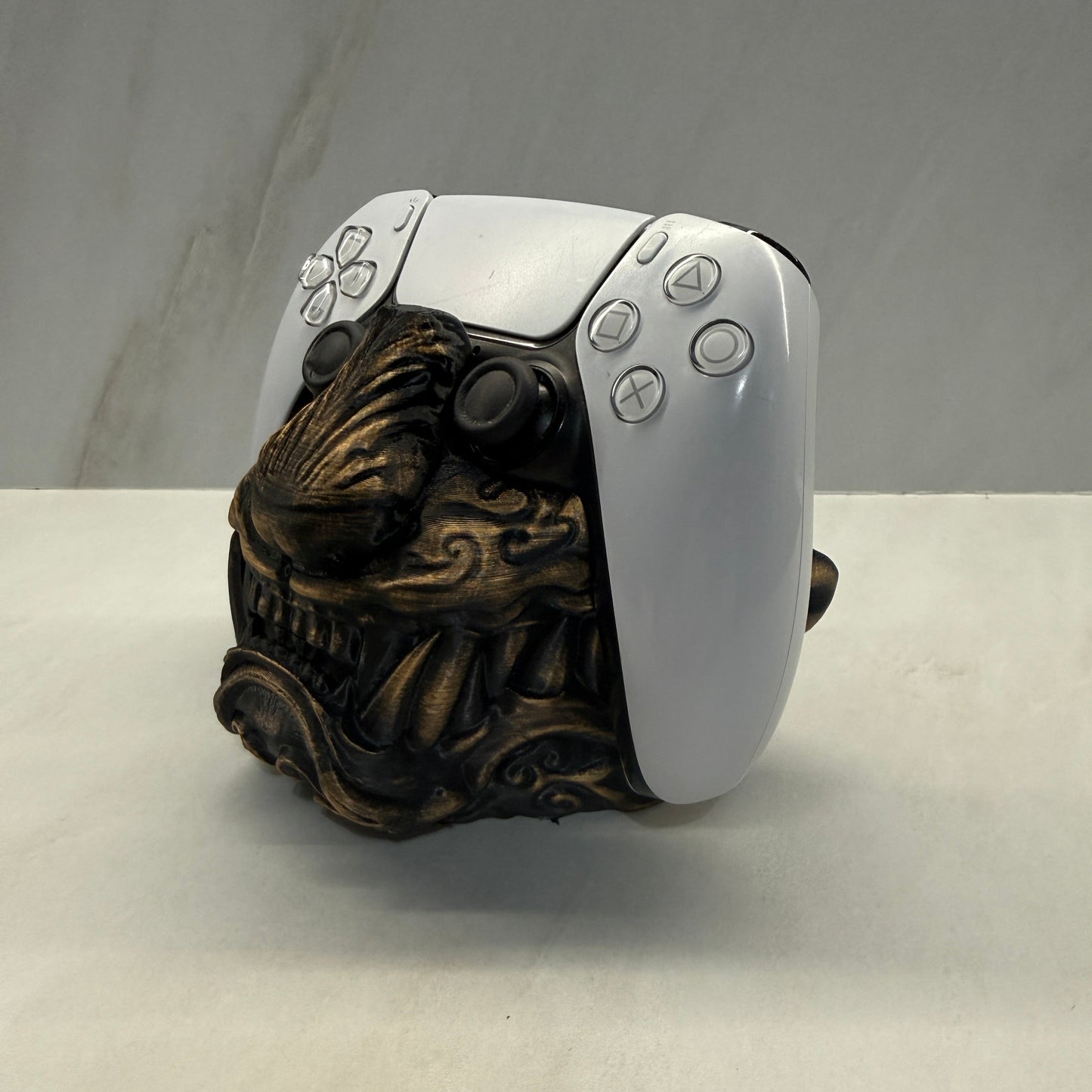 Decorative door handle with intricate design on a white and gray background