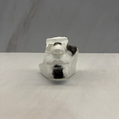 Clear plastic component on a gray background
