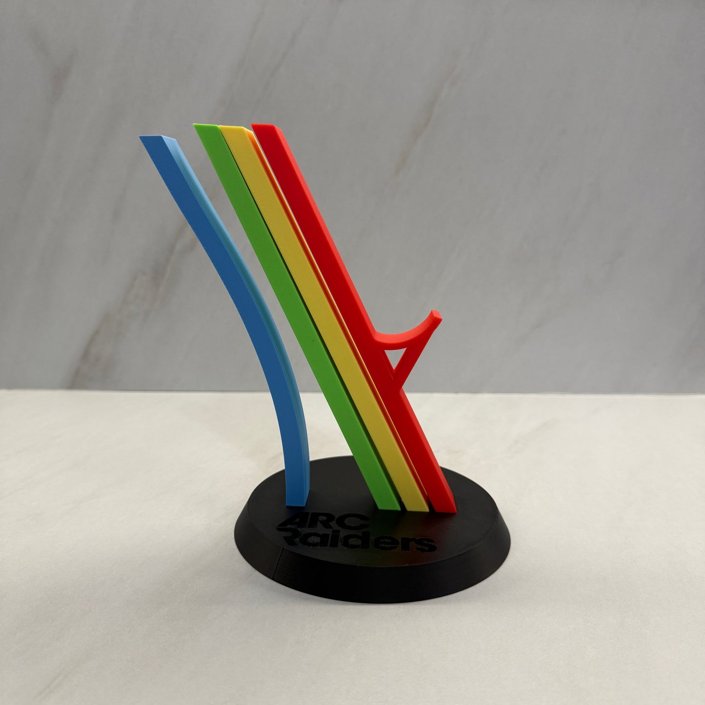 Colorful cable tie on a white wall with a blurred background
