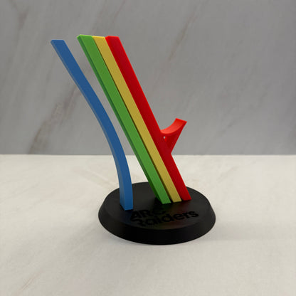 Colorful magnetic strip with red, yellow, green, and blue sections attached to a white wall. Arc Raiders controller stand
