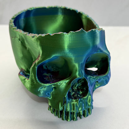 Green ceramic vase with textured surface on a white background