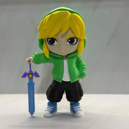 Toy figure of a character with a green hoodie and yellow hair holding a sword on a white background